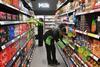 Staff working in an Asda Express